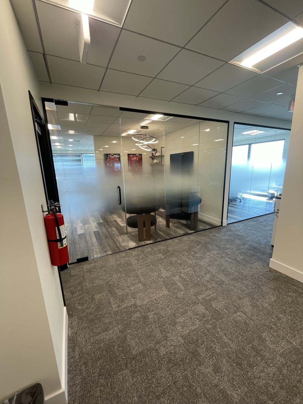 Frameless glass conference room with gradient privacy film